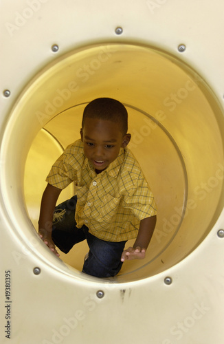 Photo: African American boy on playground African American boy on playground