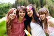 Photo: Portrait happy young students in park Portrait happy young students in park