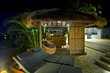 Resort style living with Bali hut with bar and deck chairs