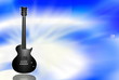 black electric guitar on blue background