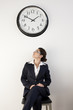 Office Worker Looking at Clock