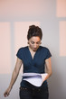 Young Woman Reading Document