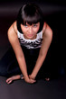 charming caucasian girl sitting on floor isolated