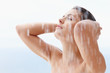 Sexy woman bathing under an outdoor shower Sexy woman bathing under an outdoor shower
