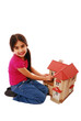 Photo: Young girl playing with house Young girl playing with house
