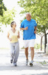 Senior Couple Jogging In Park