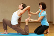 Foto: teacher helping with yoga pose teacher helping with yoga pose