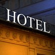 Illuminated old hotel sign
