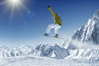 Jumping Snowboarder in alpine mountains Jumping Snowboarder in alpine mountains