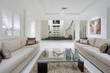 Luxurious living room with grand entrance in the background