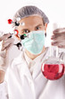 Scientist holding Flask and Atoms