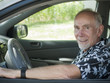 Senior man at wheel of car
