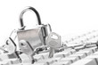 Computer  keyboard secured with chain and padlock..
