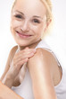 oung beautiful girl applying cream