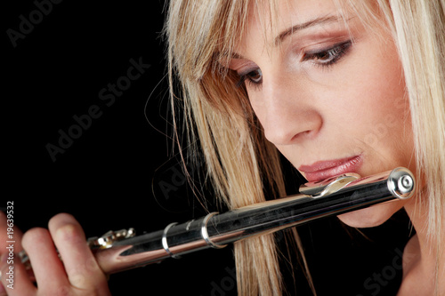 Portrait of a woman playing transverse flute