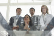 Business team looking through a glass