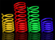 vector colour springs on black background with reflection vector colour springs on black background with reflection