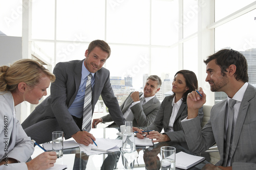 Photo: Young man leading a meeting Young man leading a meeting