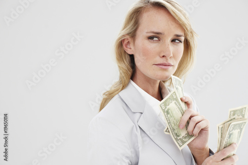 Photo: Young woman counting money Young woman counting money