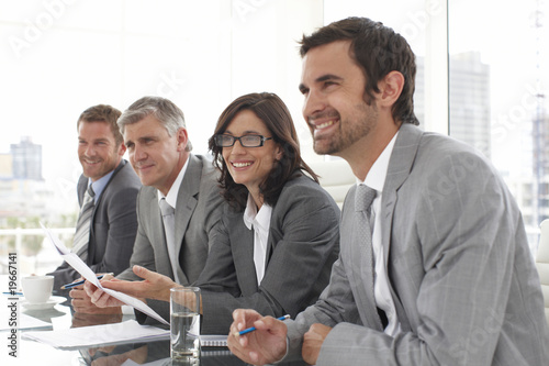 Photo: Businesspeople listening to a candidate Businesspeople listening to a candidate