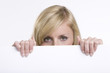 Beautiful business woman holding empty white board