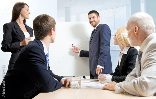 Foto: White collar workers at a meeting White collar workers at a meeting