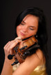 Young beautiful woman with a violin