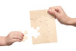 Foto: mens and childs hands finishing set of puzzles mens and childs hands finishing set of puzzles