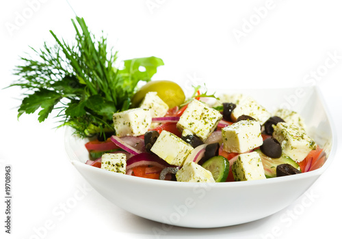 Photo: Greek Salad in white plate Greek Salad in white plate