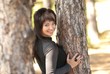 Pretty woman near tree Pretty woman near tree