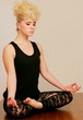 Young woman in yoga meditation pose