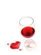 Spilling red whine forming a heart shape