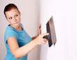 Photo: Female make repairs in the apartment Female make repairs in the apartment