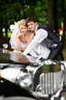 Photo: Groom adn bride about retro limousine Groom adn bride about retro limousine