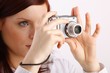 young woman with a camera