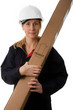 Tradeswoman wearing hard hat holding package