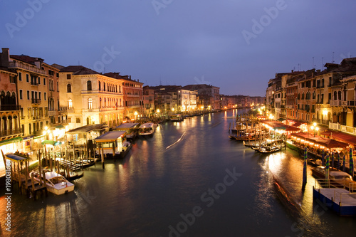 Photo: Night life along Venetian Grand Canal by Rialto bridge Night life along Venetian Grand Canal by Rialto bridge