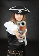 Woman pirate aims in us from an ancient pistol Woman pirate aims in us from an ancient pistol