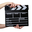 Two hands with a movie clapper board close. Isolated over white Two hands with a movie clapper board close. Isolated over white