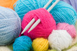 colored wool clews with needles as background colored wool clews with needles as background