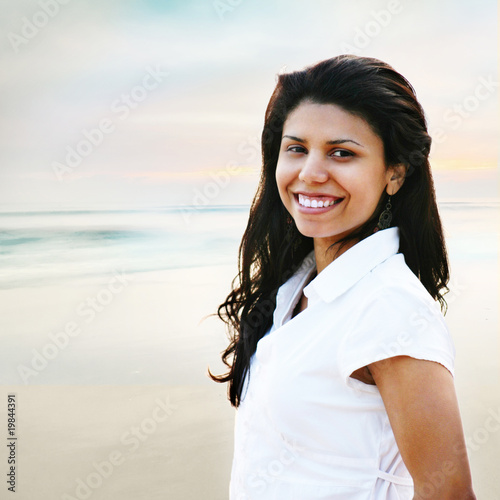 Photo: Smiling Young Woman Portrait at the Beach Smiling Young Woman Portrait at the Beach