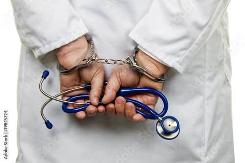 Photo: Doctor with stethoscope and handcuffs Doctor with stethoscope and handcuffs