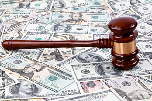 Photo: U.S. dollars bills and Judge Hammer U.S. dollars bills and Judge Hammer