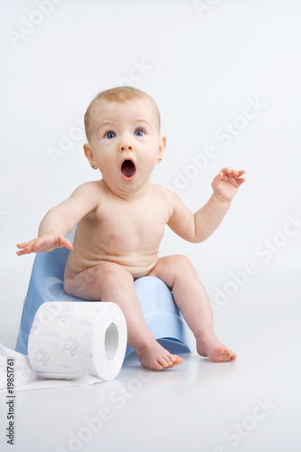 Photo: Surprised infant on potty. Surprised infant on potty.