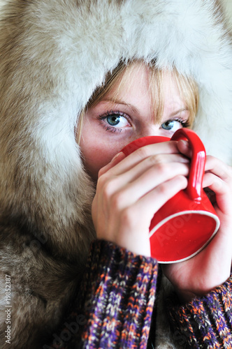 Photo: girl with cup of hot tea girl with cup of hot tea