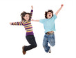 Two happy children jumping at once Two happy children jumping at once