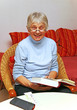 Photo: Happy Senior with Book - Seniorin beim Lesen Happy Senior with Book - Seniorin beim Lesen