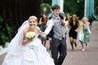 Photo: Happy bride flees with her fiance on the wedding walk Happy bride flees with her fiance on the wedding walk