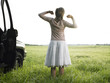 Woman in Field Stretching