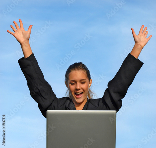 Photo: businesswoman showing excitement of a successful deal businesswoman showing excitement of a successful deal